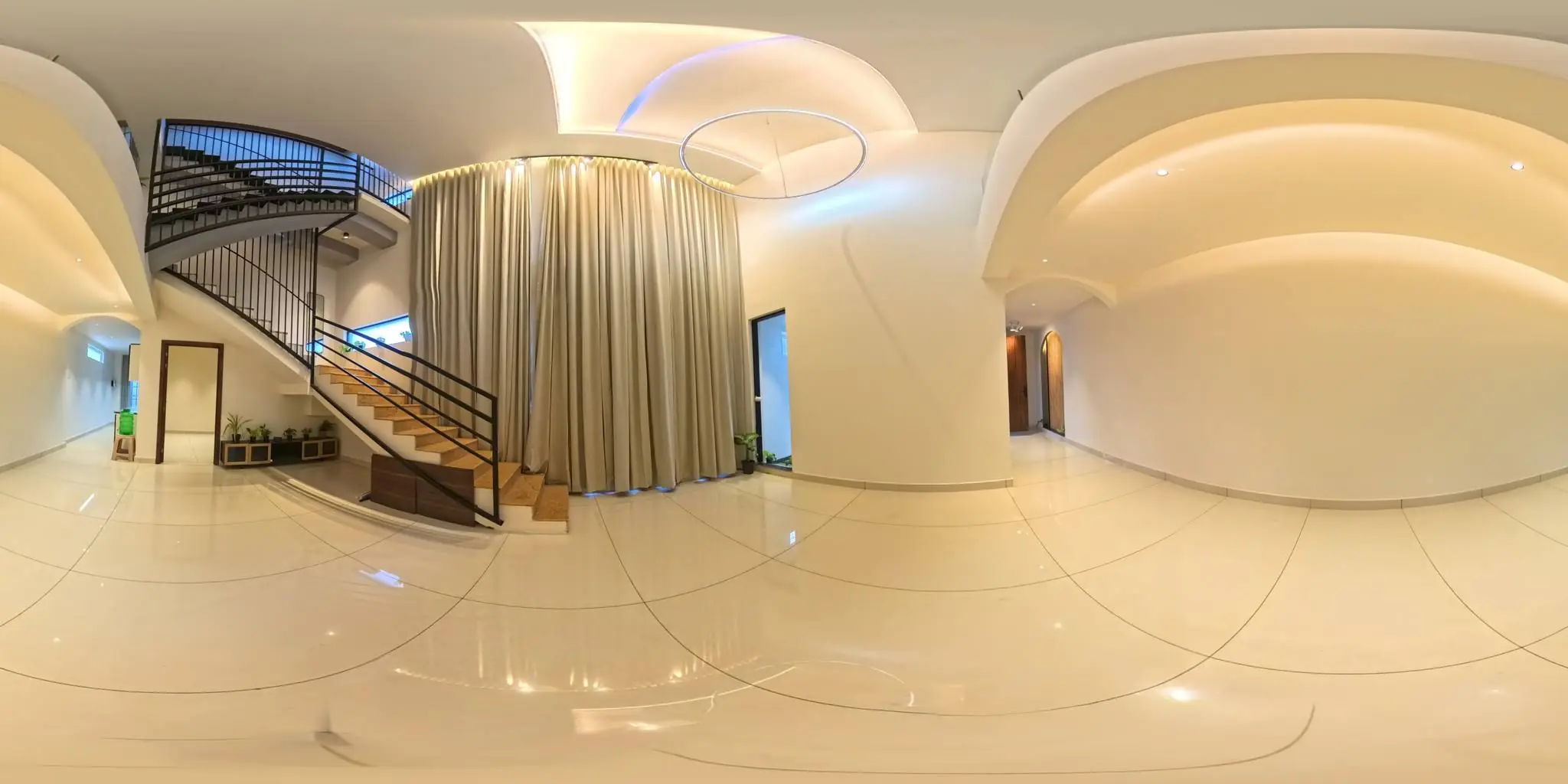 360° view of the double-height foyer and curved staircase