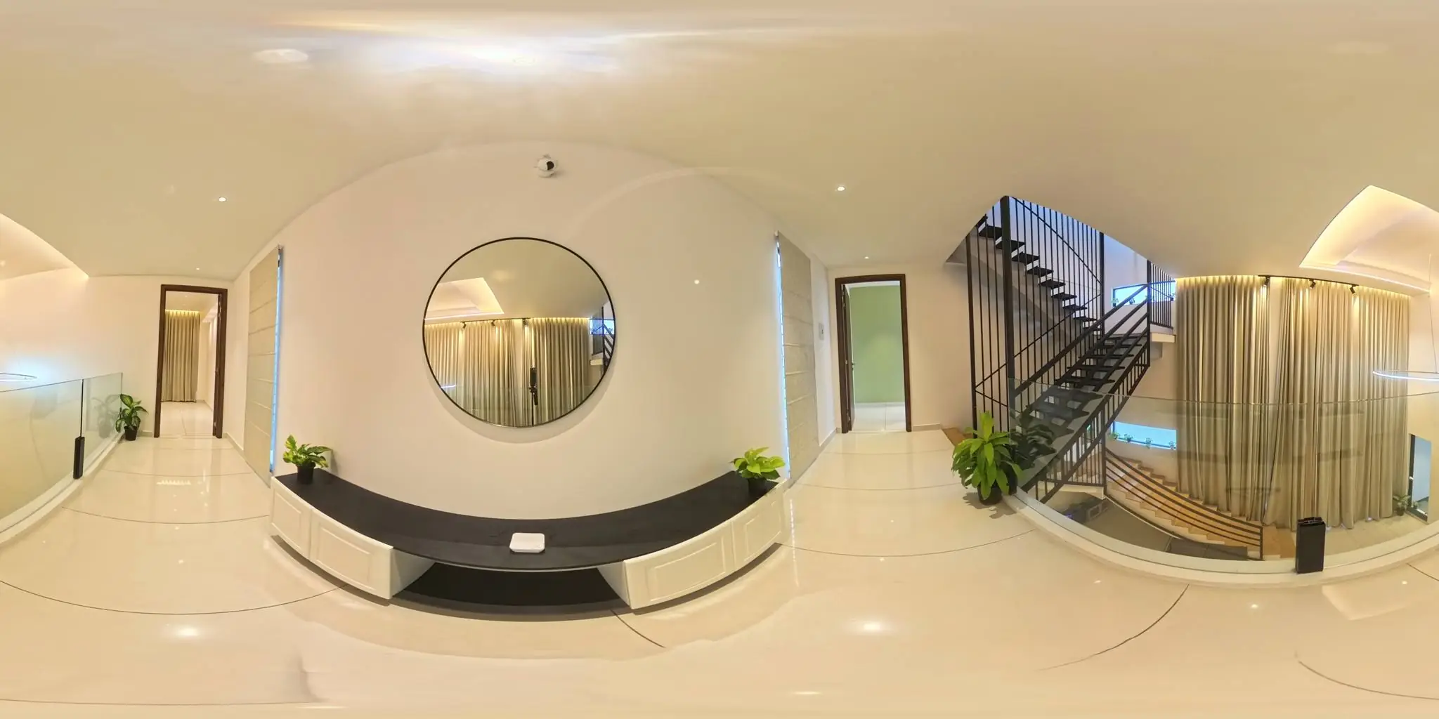 360° view of the hallway with round mirror and staircase